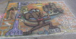The finished creation of a dog spray painting a depiction of dogs playing poker